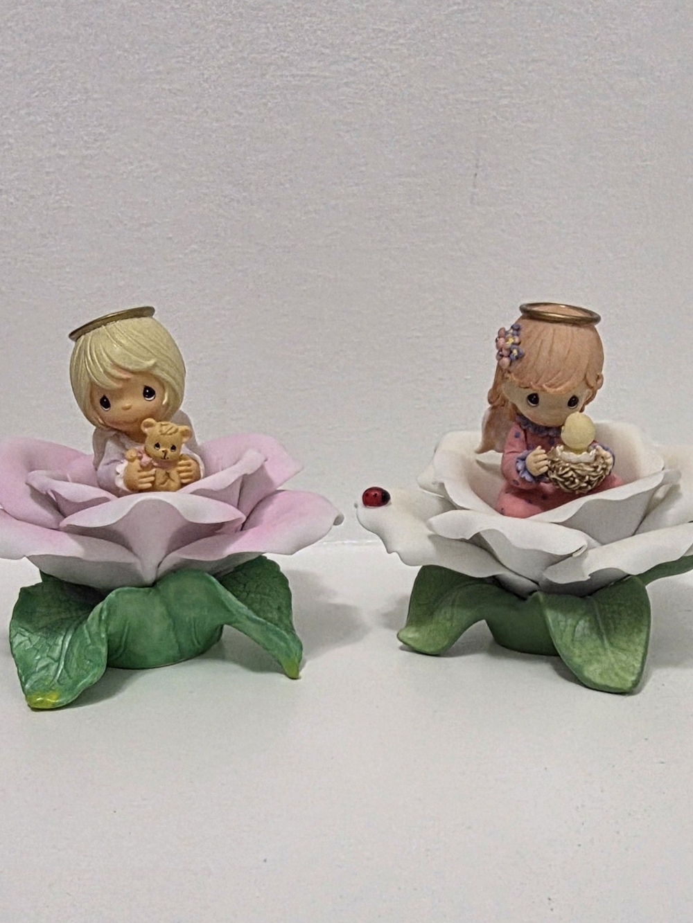 Precious Moments Pink and White Flower Figurines